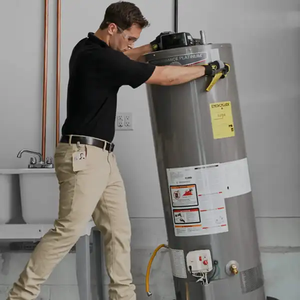 Technician installing a water heater